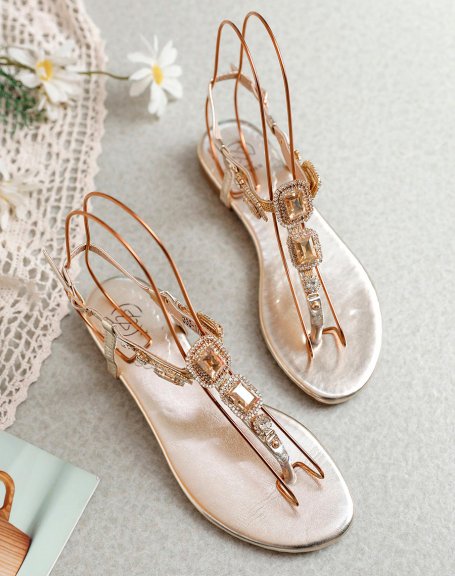 Golden sandals with shiny square jewels