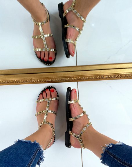 Golden sandals with small studded details