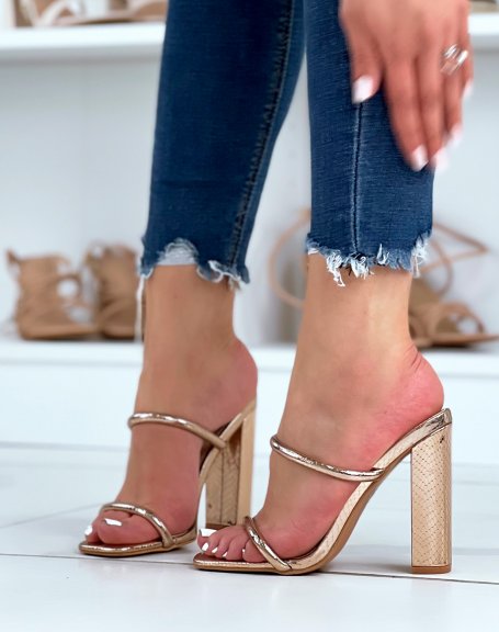 Golden sandals with thin double straps with heel