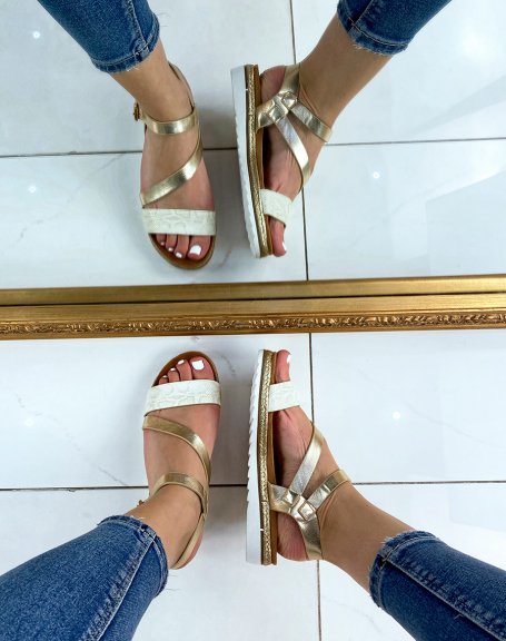 Golden sandals with white snake effect strap
