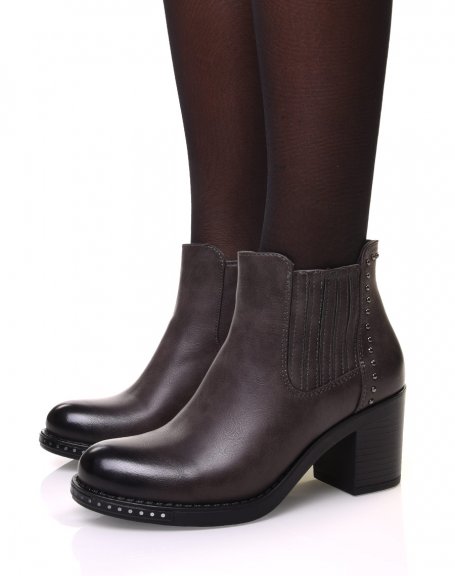 Gray ankle boots with heels adorned with small round studs