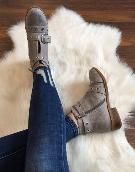 Gray ankle boots with studded straps open at the front