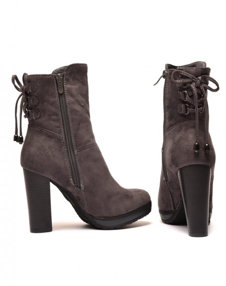 Gray high heeled ankle boots with corset-style lace