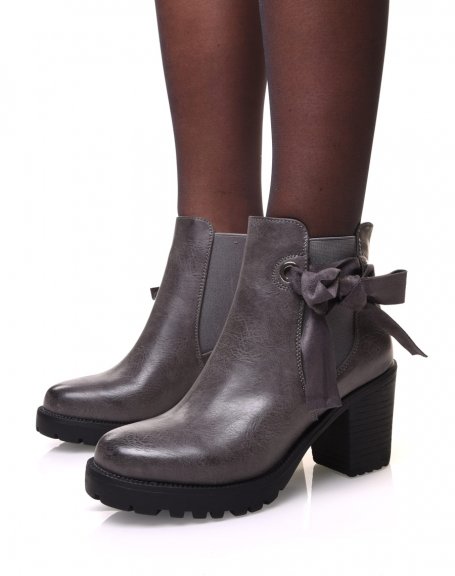 Gray notched ankle boots with bow and eyelets