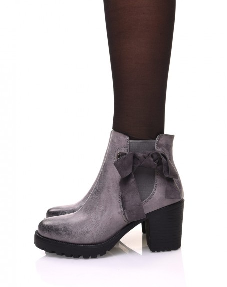 Gray notched ankle boots with knots and eyelets