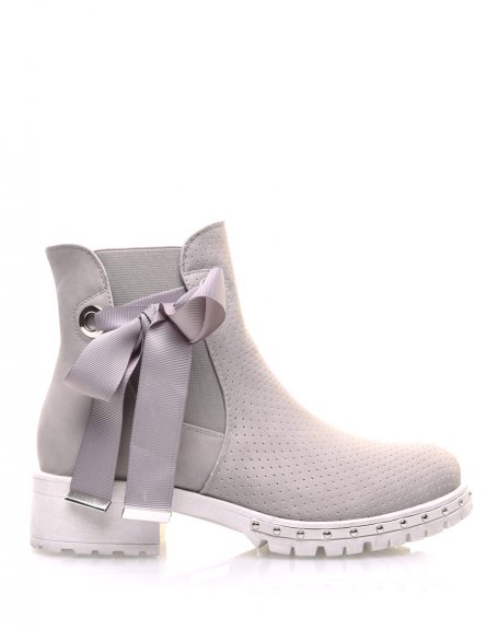 Gray perforated ankle boots with notched soles
