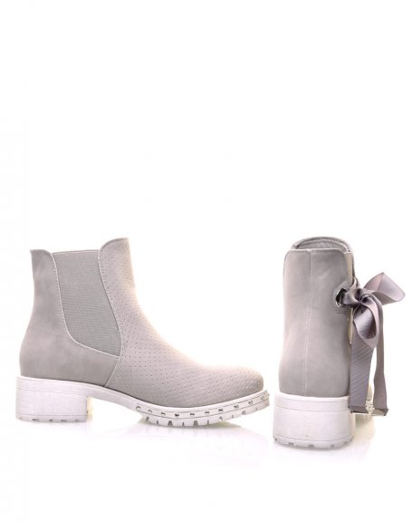 Gray perforated ankle boots with notched soles