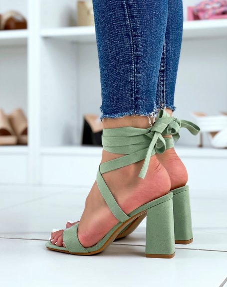 Green sandals with thick strap and long lace-up heel