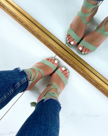 Green sandals with thick strap and long lace-up heel