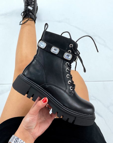 High black ankle boots adorned with a jeweled strap