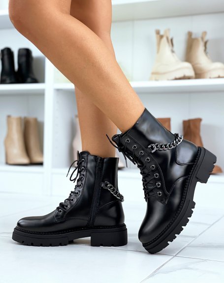High matt black ankle boots adorned with a gray chain