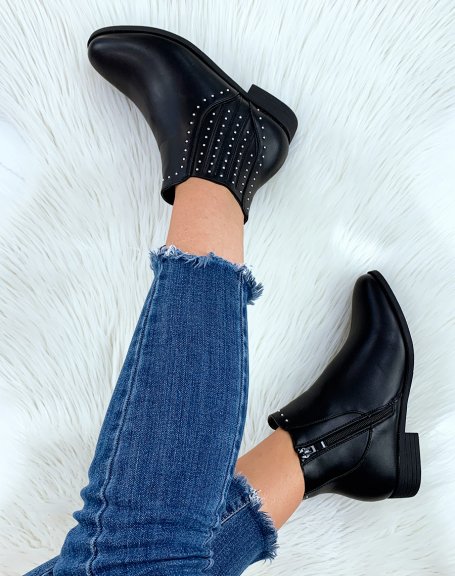 Low black ankle boots adorned with studs
