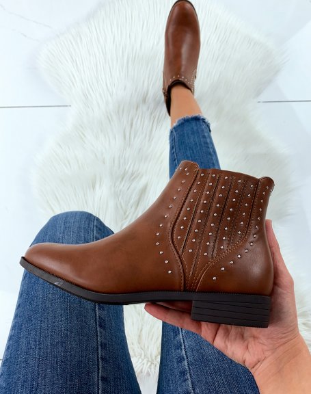 Low camel ankle boots adorned with studs