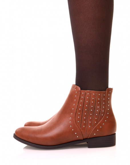 Low camel ankle boots adorned with studs