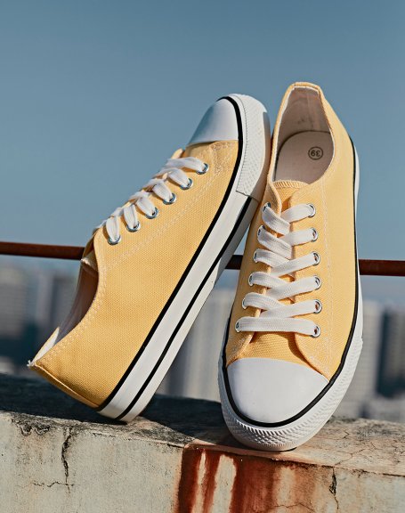 Low sneakers in yellow fabric