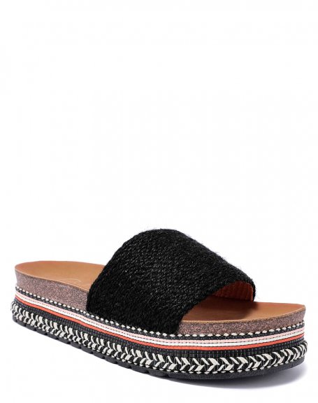 Mules with thick black strap and thick Aztec style sole