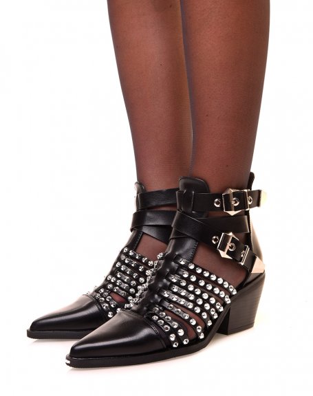 Openwork black cowboy boots adorned with studs