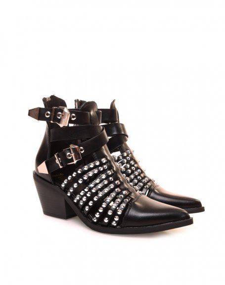 Openwork black cowboy boots adorned with studs