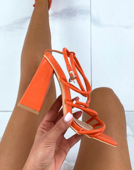 Orange heeled sandals with multiple straps