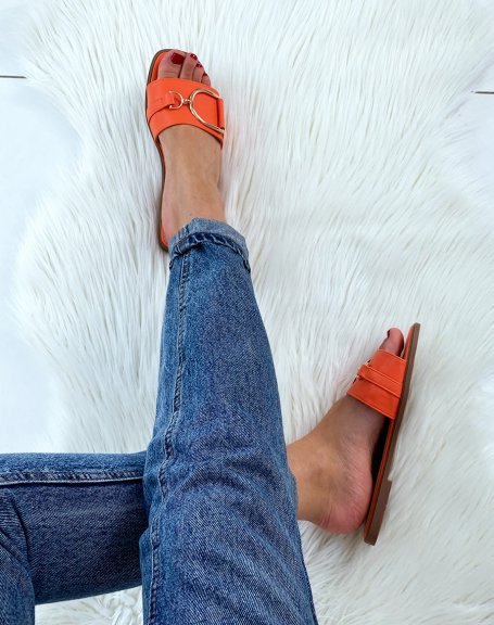 Orange mules with chunky buckles