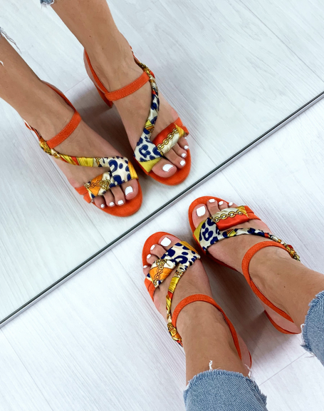 Orange sandals with braided strap with a printed scarf