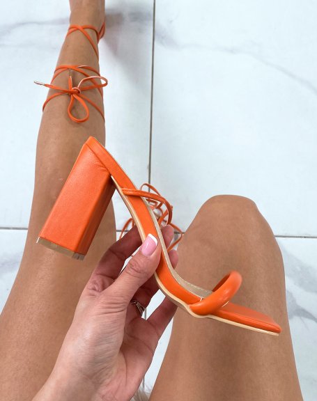 Orange sandals with laces and thin heel strap