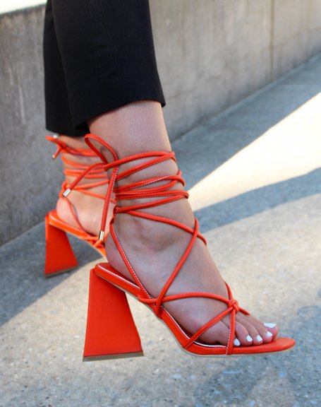 Orange sandals with laces and triangular heel
