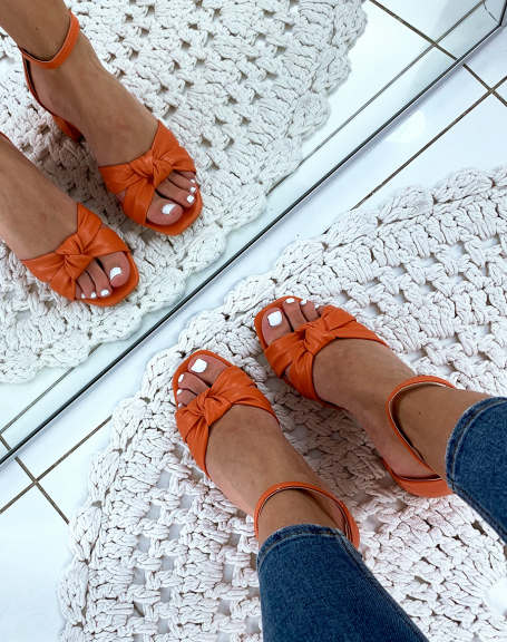 Orange sandals with tied straps
