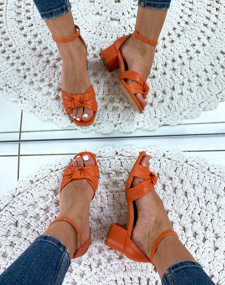 Orange sandals with tied straps