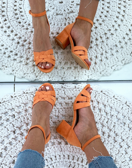 Orange suede sandals with small square heels and wide fancy straps