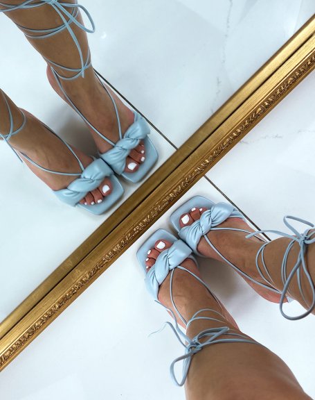 Pastel blue heeled sandals with high lace and twisted strap