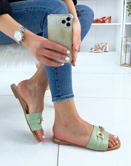 Pastel green mules with wide strap and gold detail