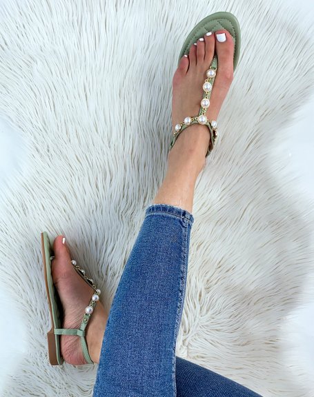 Pastel green sandals adorned with white pearls