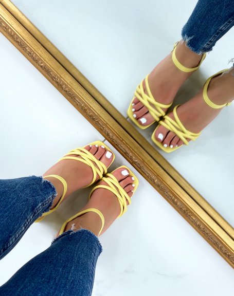 Pastel yellow sandals with small heel and multiple straps