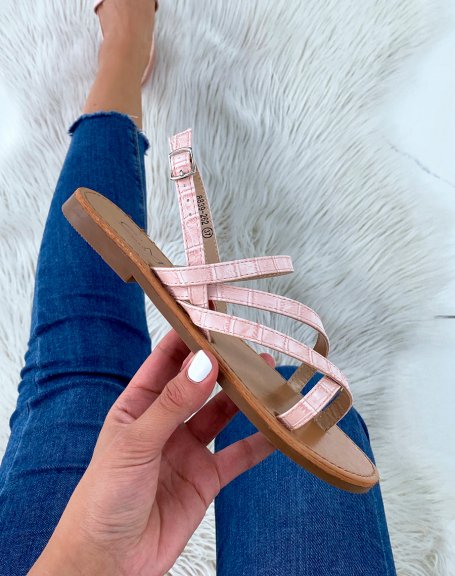 Pink croc-effect slippers with multiple crisscrossing straps