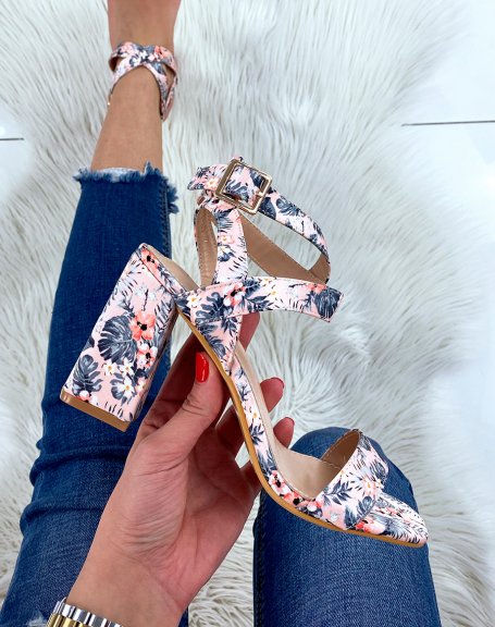 Pink heeled sandals with floral patterns and crossed straps