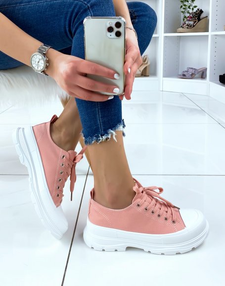 Pink sneakers with notched sole