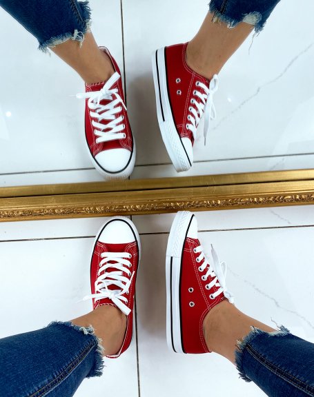 Red canvas low top sneakers