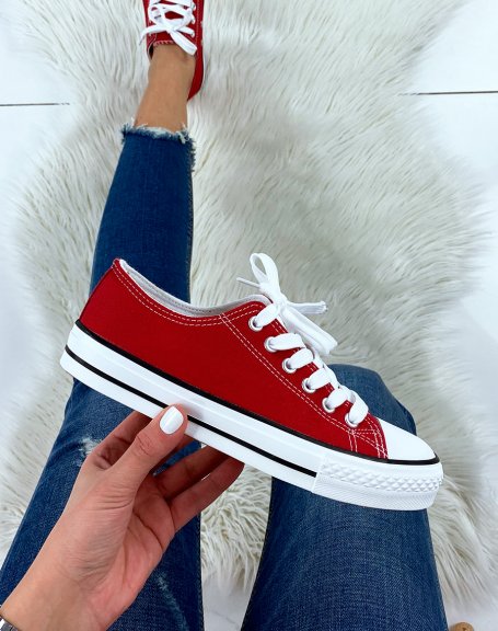 Red canvas low top sneakers
