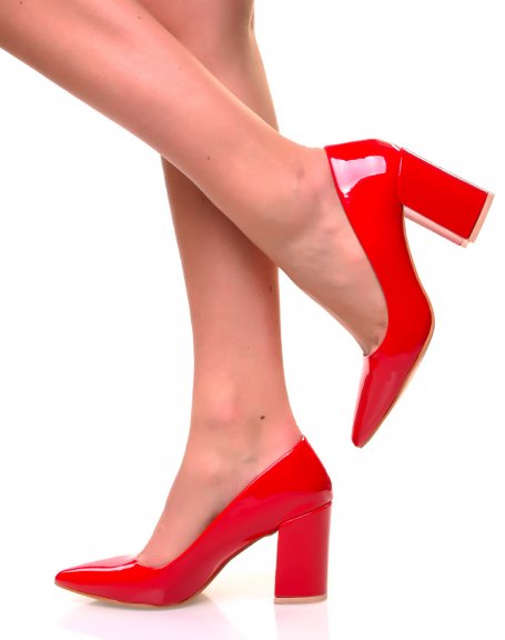 Red patent pumps with square heels and pointed toes