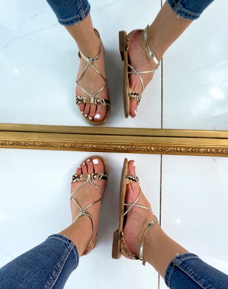 Sandals with golden straps and snake effect