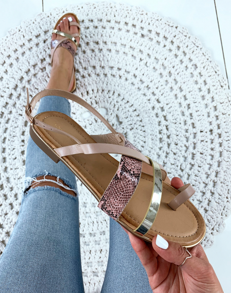 Sandals with multiple crisscrossing golden pink straps and python effect