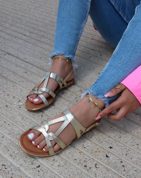 Shiny gold sandals with buckled straps