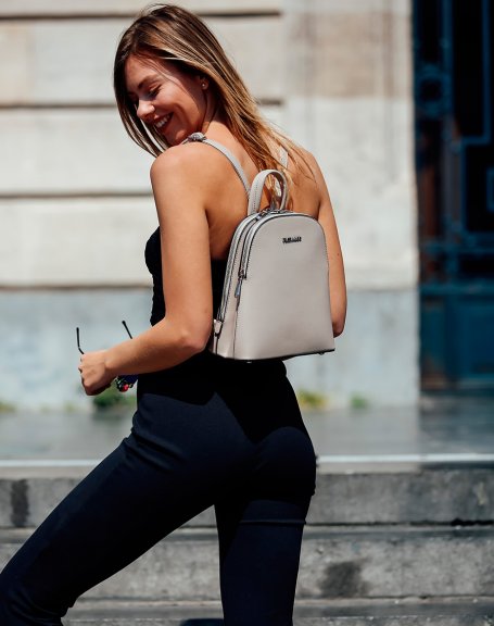 Small beige backpack with thin straps