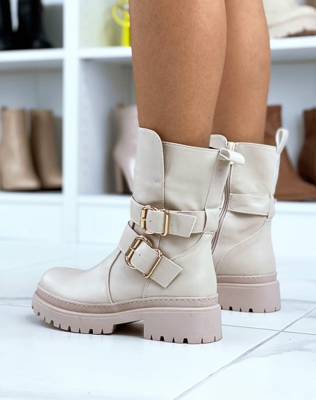 Tall beige ankle boots with golden buckles