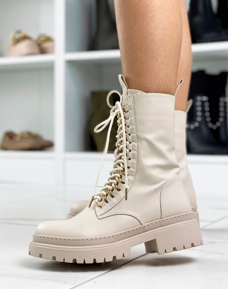 Tall beige ankle boots with golden chain