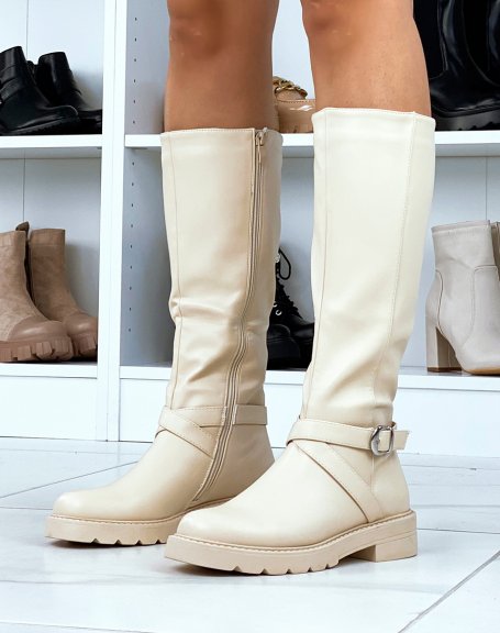 Tall beige boots with crossed straps