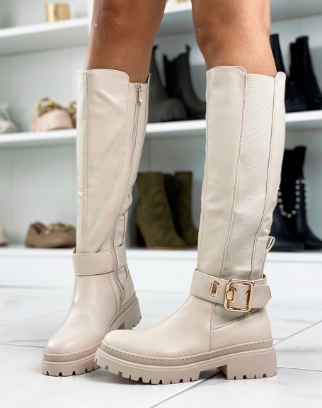 Tall beige boots with golden buckle