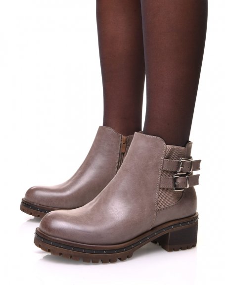 Taupe ankle boots with lugged and studded soles