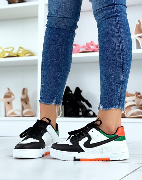 White and black sneakers with orange and green details